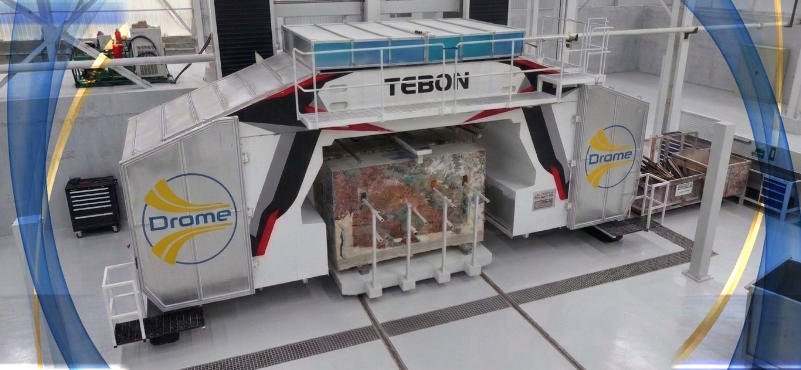 Drome multiwire machine cutting a stone block in a workshop